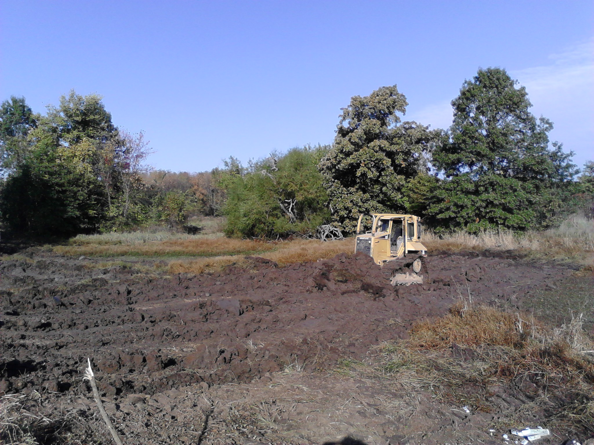 Attached picture Mucking out pond bottom Jpond.jpg
